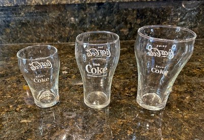 VINTAGE GERMAN TRINK COCA COLA LIMONADE BELL GLASS AND TWO AMERICAN DRINK COCA C