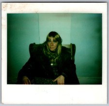 Vtg Polaroid Snapshot Photo Blonde Woman Bangs Fur Coat Chair Wall 1970s