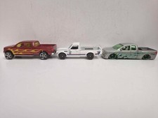 Lot of 3 Hot Wheels Pick-up 1:64 Ford F-150 Datsun 620 Nissan Titan used unboxed