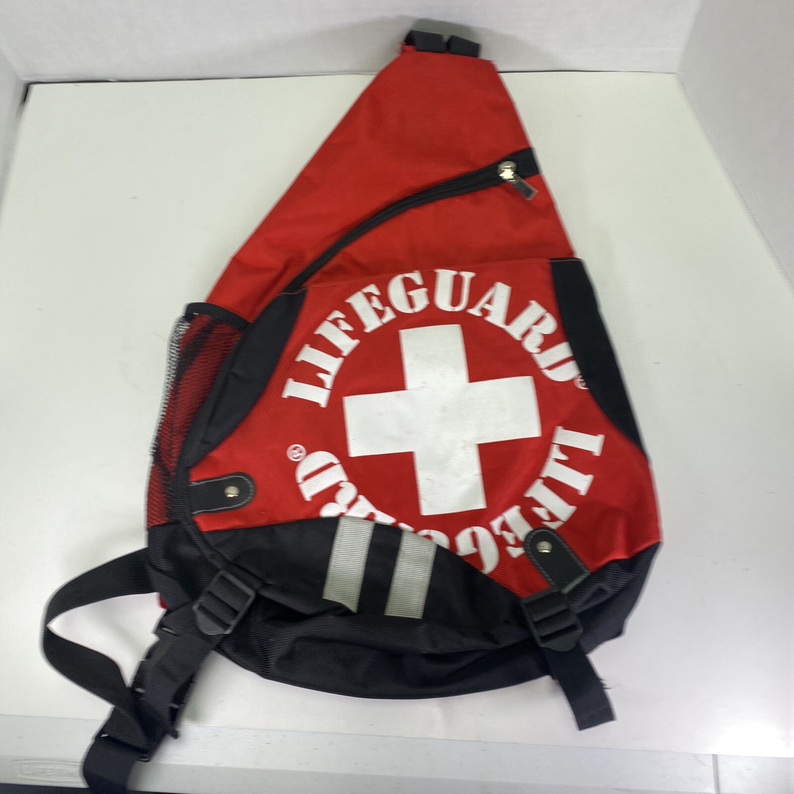 Sling Style Backpack Lifeguard  - Black  Red White  3 pockets  carry handle