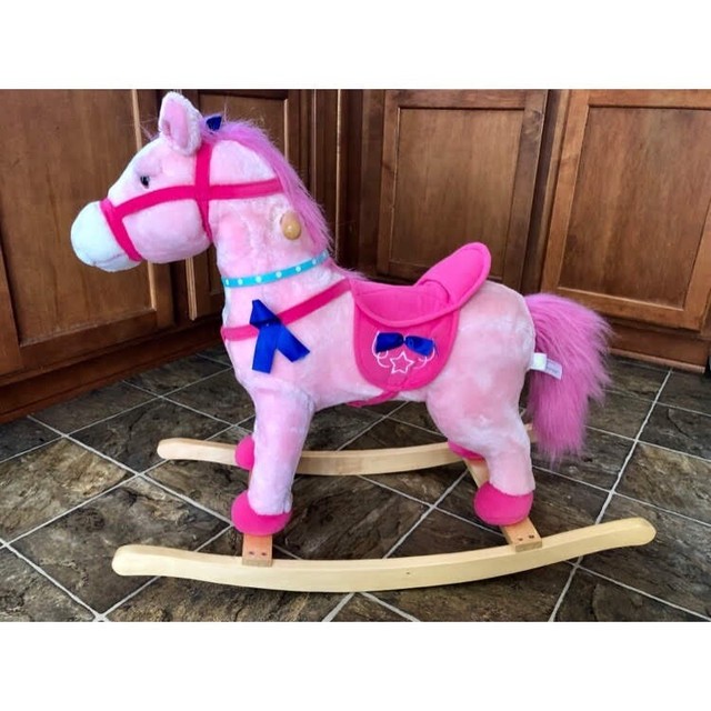 pink wooden rocking horse