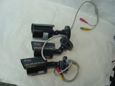  3 Q-SEE SECURITY CAMERAS QSM1424W - ONE HAS THE CORDS CUT - AS SHOWN