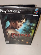 Primal (Sony PlayStation 2, 2003) includes a manual and registration card.