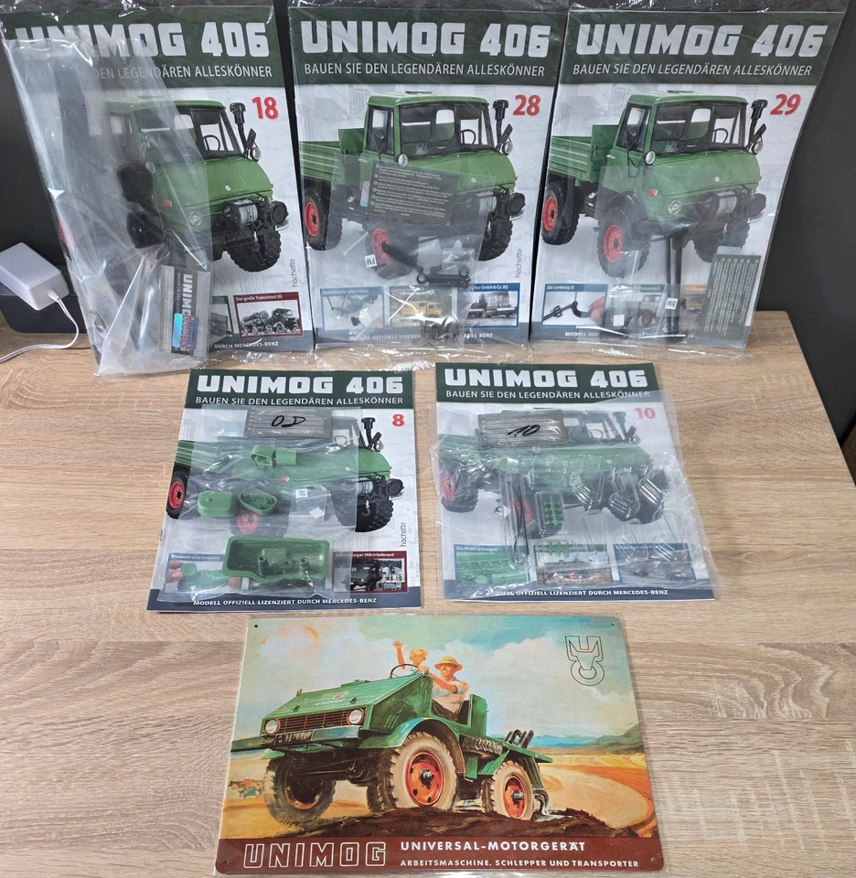 11 Hachette Unimog 406 Hefte mit Bauteilen Modellbau 1:8 Hefte Blechschild - Bild 2 von 3