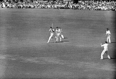 Surrey Eric Bedser lofts a ball from Middlesex Fred Titmus bou- Old Photo 1
