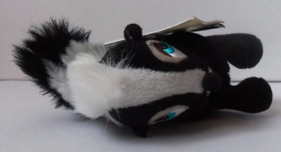 Flower The Skunk Plush Toy - 9 Inch Stuffed Animal Holding Bouquet, Soft & Cute Collectible