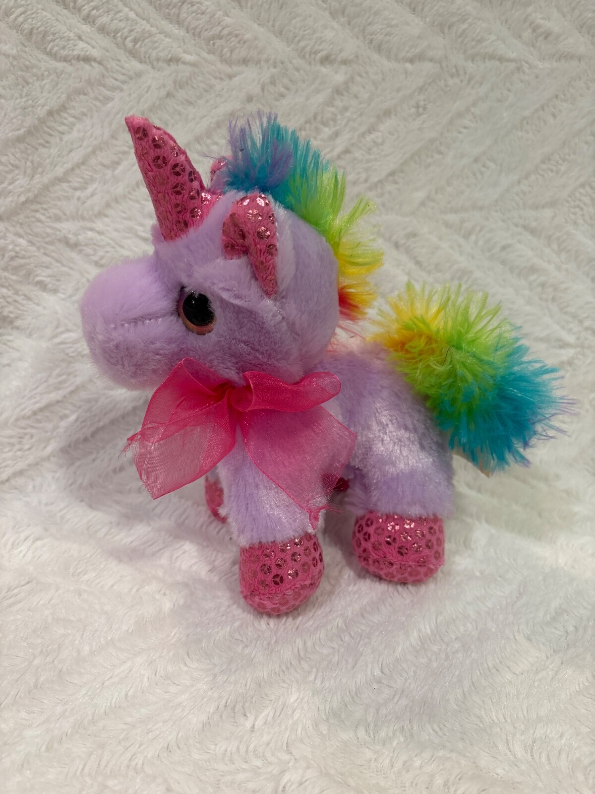 Unicorn baby plush with pink bow in purple rainbow colors 8 inch
