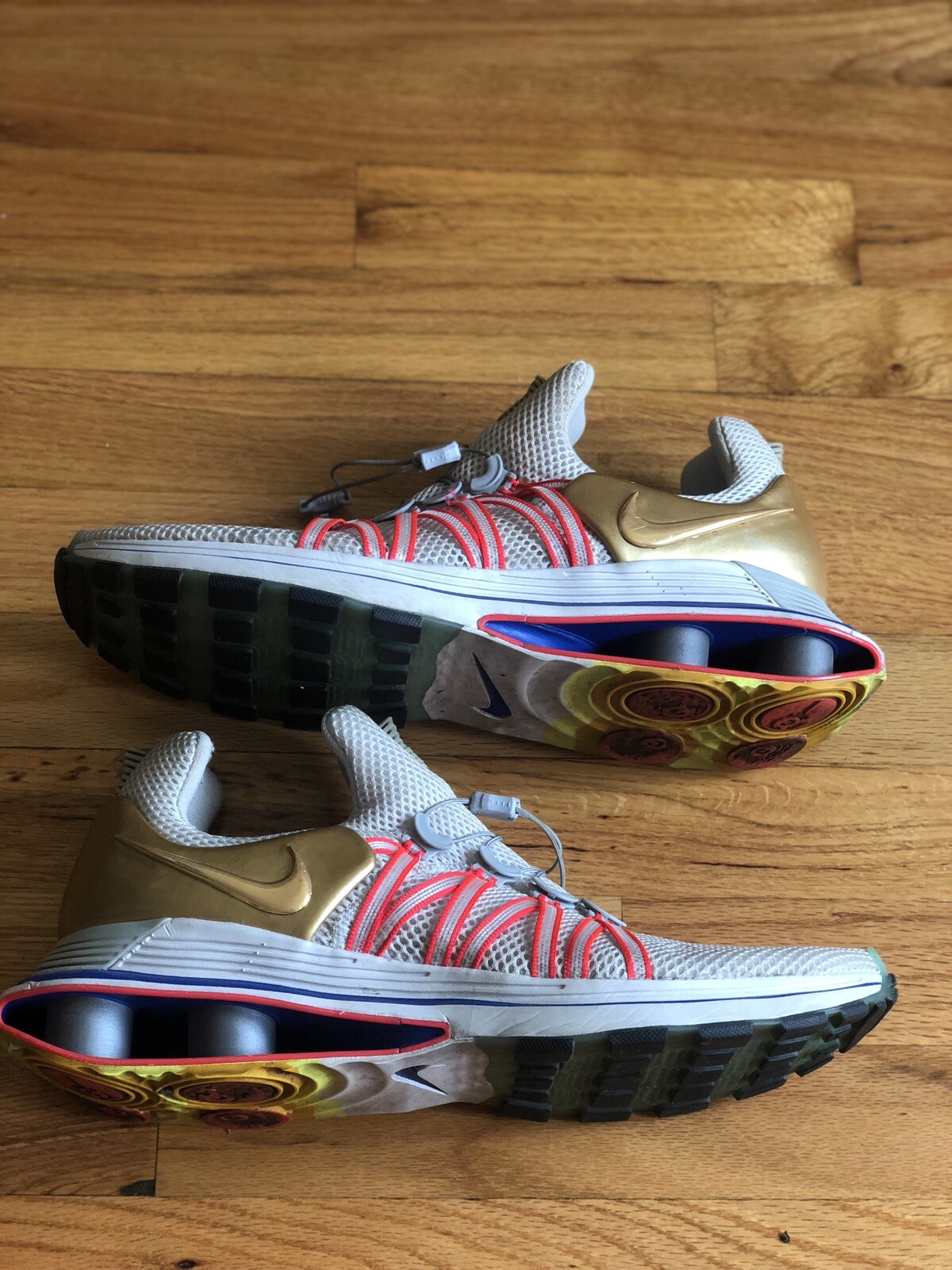 nike shox gravity vast grey metallic gold