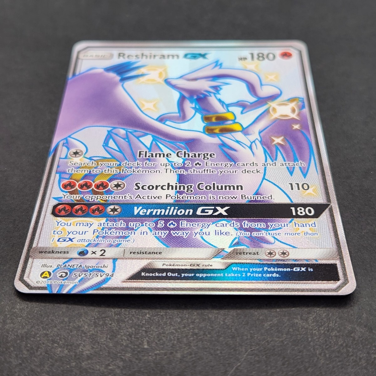 Carta Reshiram e Charizard-GX (NM)