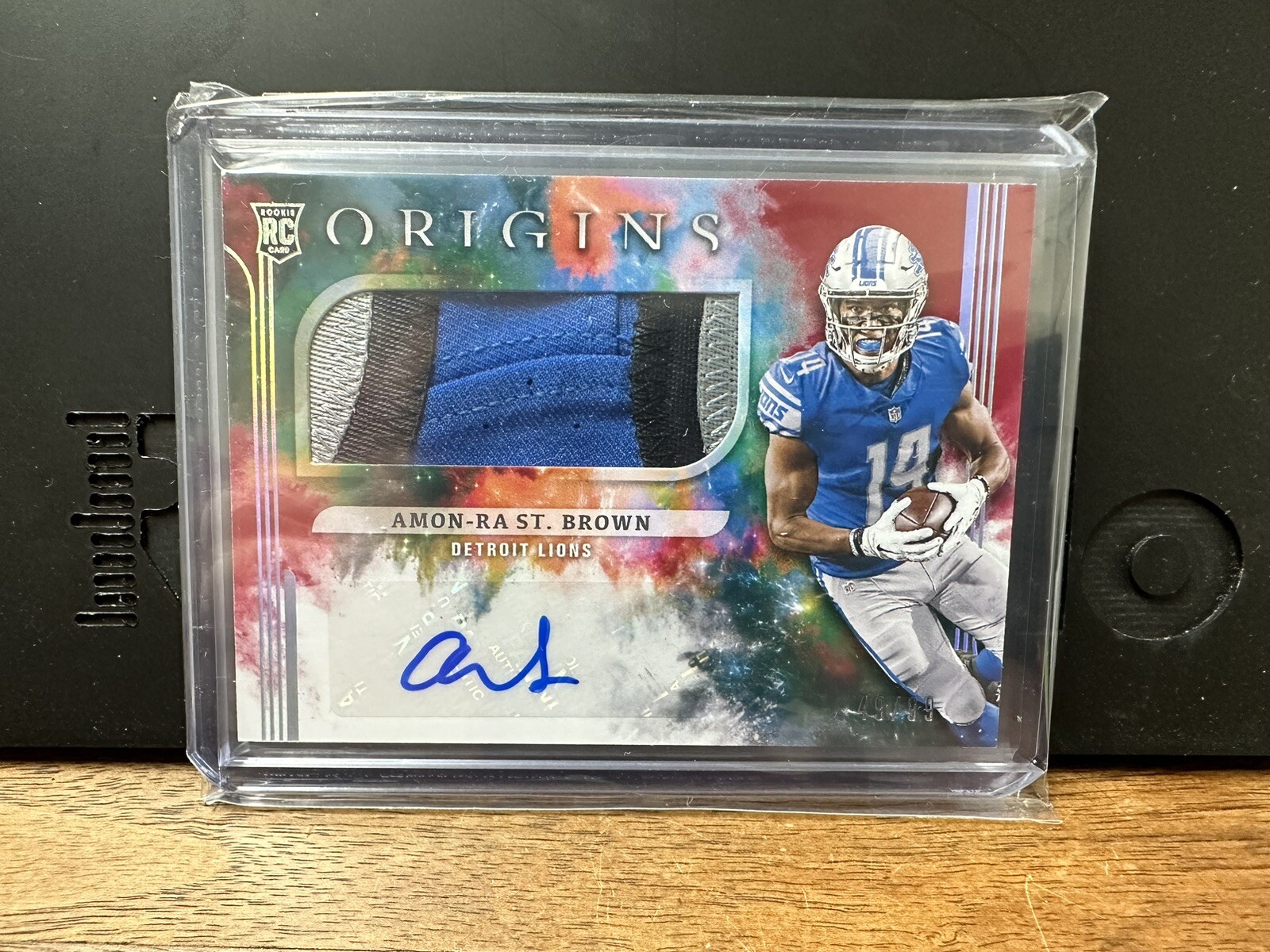 2021 Panini Origins - Amon-Ra St. Brown  Rookie Jumbo Jersey RED rpa /99  #183
