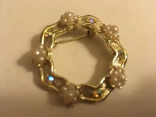 rhinestone and faux pearl and aurora rhinestone gold tone circle of life brooch
