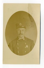 Man in uniform, huge buttons, badge, fireman?, pince-nez, RPPC postcard