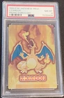 1999 Pokemon CHARIZARD Holo MEIJI PROMO Japanese LIZARDON Embossed Card - PSA 8