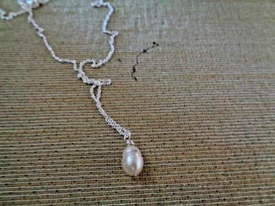 Artisan crafted ½'' white baroque freshwater pearl set with 3mm cz on sterling ch