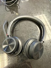 Gently used Black Poly V4320 Bluetooth Headset, with charging base