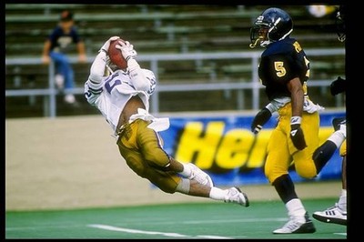 Wide receiver Andre Riley Washington Huskies catches the ball duri- Old Photo