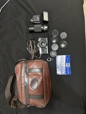 Vintage Olympus OM-10 35mm Camera with extra lens and accessories and bag