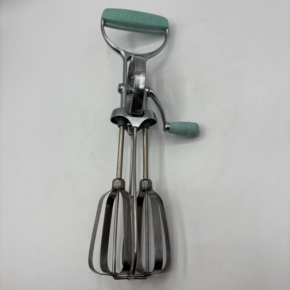 A gorgeous EKCO Flint aqua/turquoise MCM egg beater that's equal parts functional tool and mid-century sculpture.