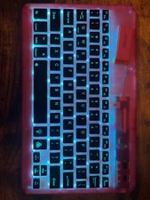 A slim pink RGB keyboard, can change color to your liking, easy connection