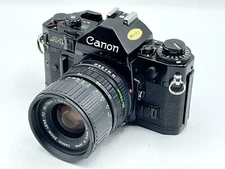 Black Canon A-1 + Canon 35-70mm f/3.5-4.5 Manual Film Camera Kit -Very Good