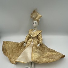 Antique German china head doll in ornate gold brocade dress. 14 tall