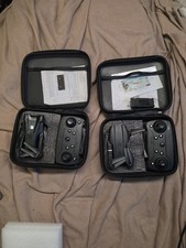 Lot of 2 E99 Foldable Mini Drones w/ Dual Cameras, Remotes, Cases & Accessories