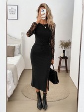 Elegant black midi dress with a fitted silhouette, lace sleeves, and a side slit