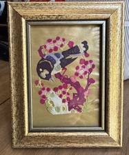Japanese oshie art, featuring a bird and floral design framed