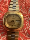 vintage Seiko 7006-5009 automatic wristwatch with a gold tone case and dial.