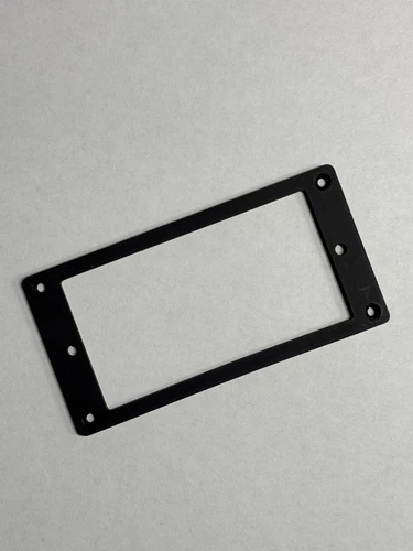 Flat, thin (2.5 mm), black Gibson Humbucker pickup ring.