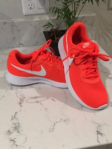 bright orange nike shoes