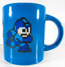RUNNING 8-BIT MEGA MAN MUG – CAPCOM / THINKGEEK – CUP 16OZ – BLUE (2014) RARE