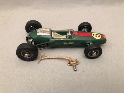 SCHUCO 1071 LOTUS FORMULA 1 WIND UP RACE CAR WITH KEY WORKING MISSING PARTS