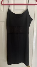 mini black dress with mesh middle segment.