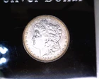 1904-O  MORGAN  DOLLAR IN ABOUT UNCIRCULATED