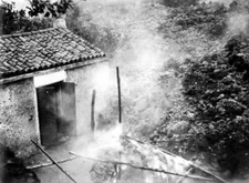 Lava flow entering a house in a village after the volcanic eruptio - Old Photo