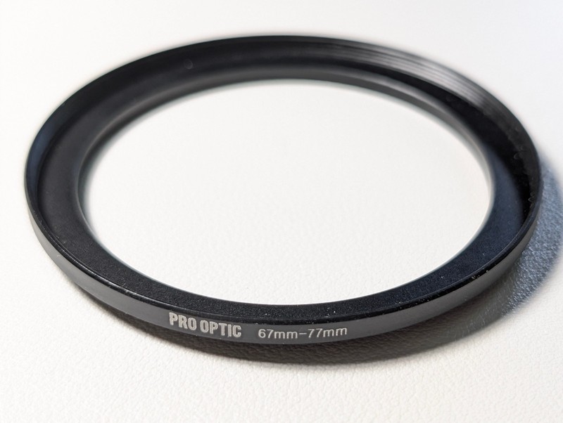 67mm to 77mm step up ring by Pro Optic
