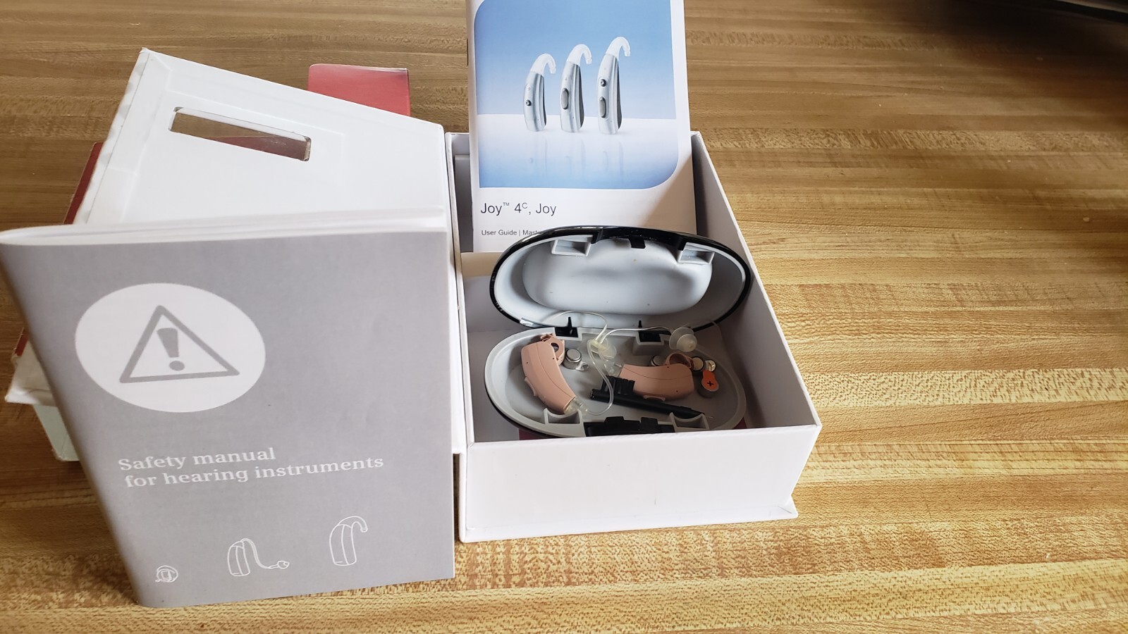 REXTON JOY M behind the ear DIGITAL HEARING AID . 2 left ear , 4 new