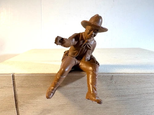 Marx 1950's original 60mm plastic Cowboy with wide brim hat sitting.