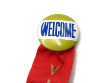 Welcome Visitor Button & Red Ribbon