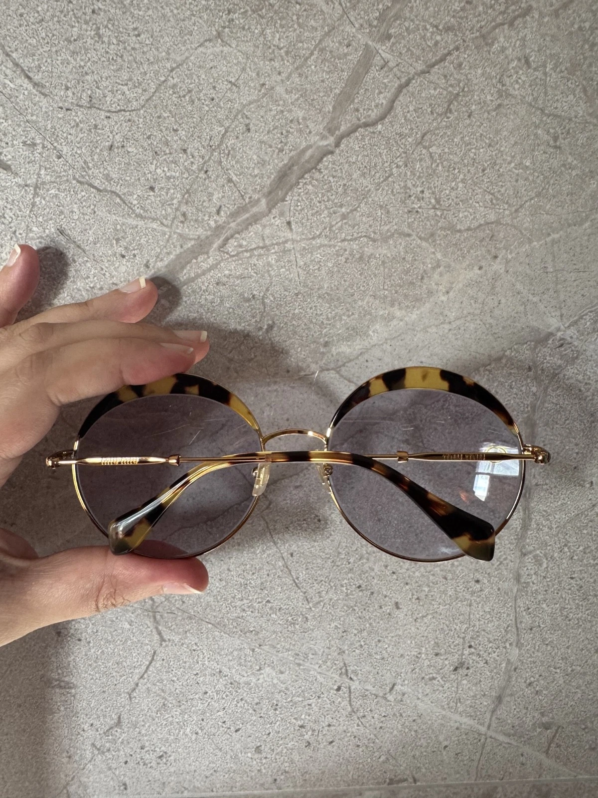 Occhiali da sole rotondi Miu Miu