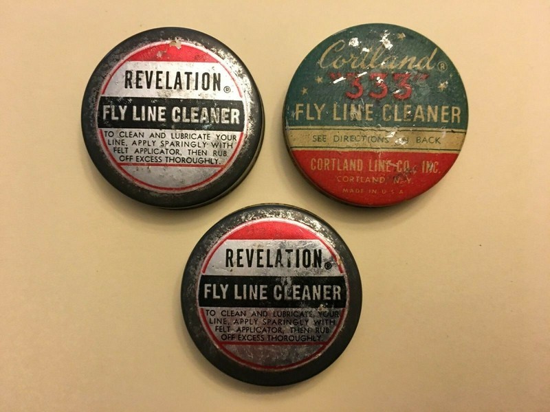 Revelation and Cortland fly fishing line cleaner tins