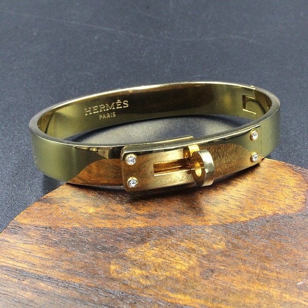 Brazalete Hermés modelo Kelly original chapado en oro.
