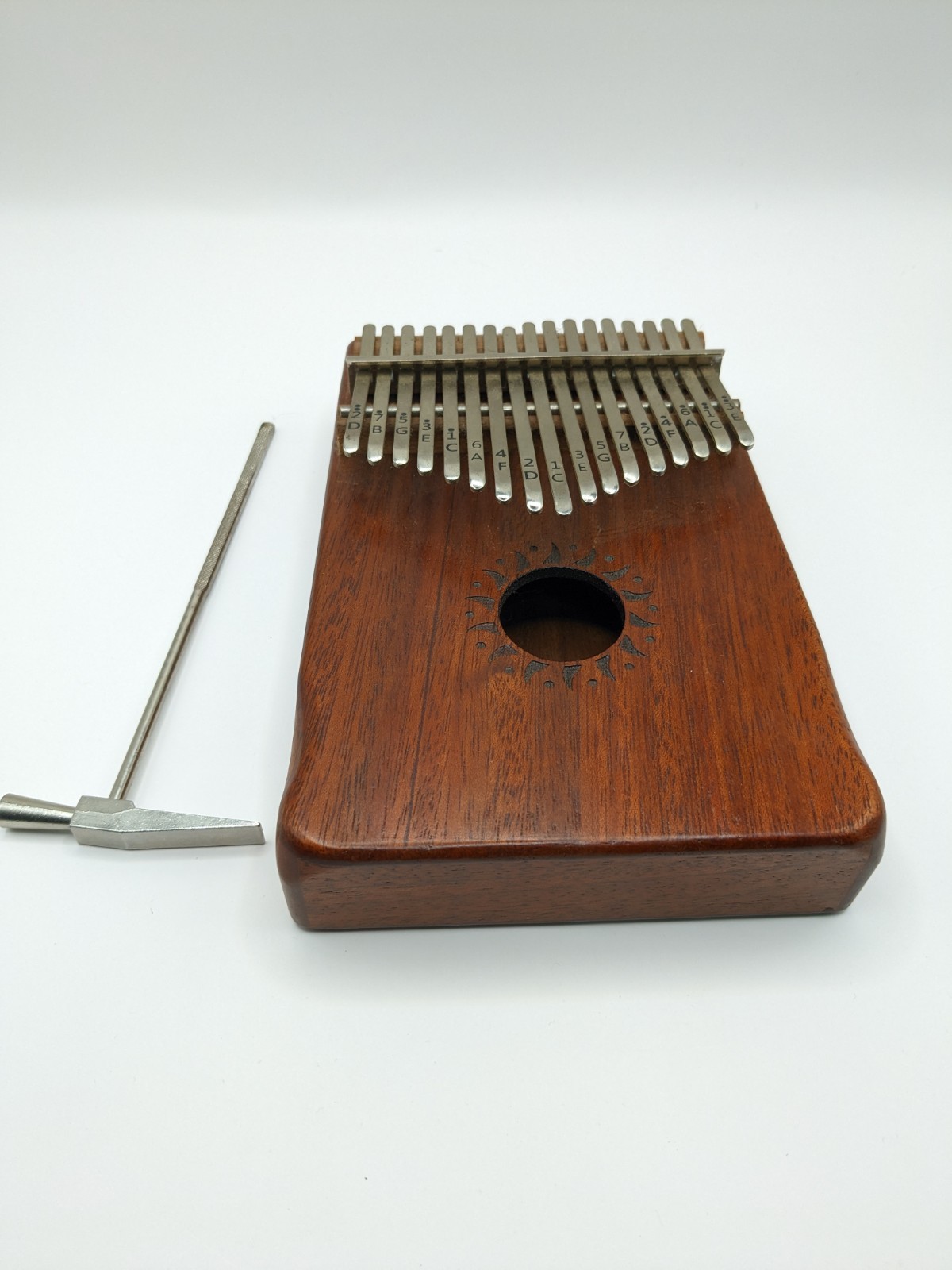  17 Key Kalimba w, Tuning Hammer Sun Pattern Around Middle 