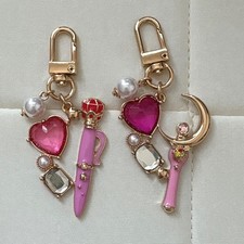 Sailor Moon bag charm, transformation pen, and moon stick set