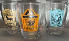 three different vintage early american Tavern Shot Glasses Clear Glass Souvenir 