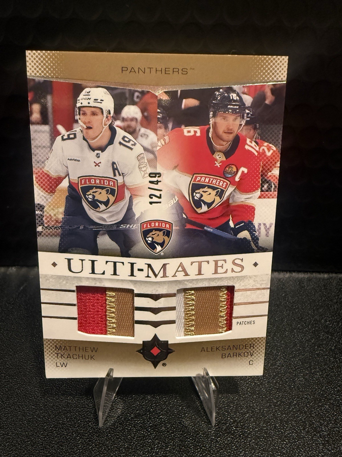 2024-25 ULTIMATE COLLECTION TKACHUK BARKOV ULTI-MATES DUAL PATCH 12/49 PANTHERS