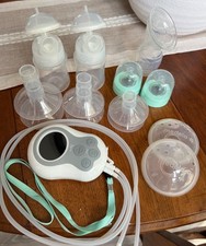 Motif Duo Hands Free Breast Pump with modela milk collectors and Haakaa included