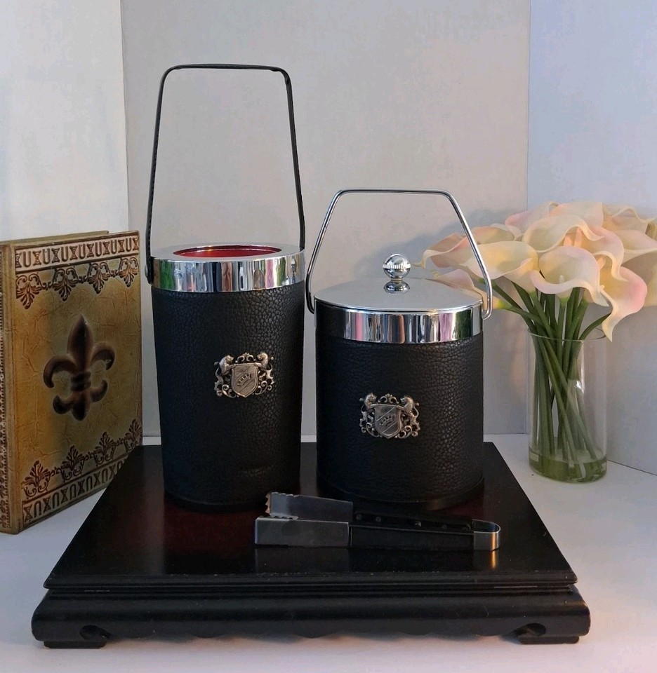 A Japanese heraldic-crest bar set — ice bucket, cooler, and tongs with striking red liners — where samurai aesthetics meet cocktail hour.