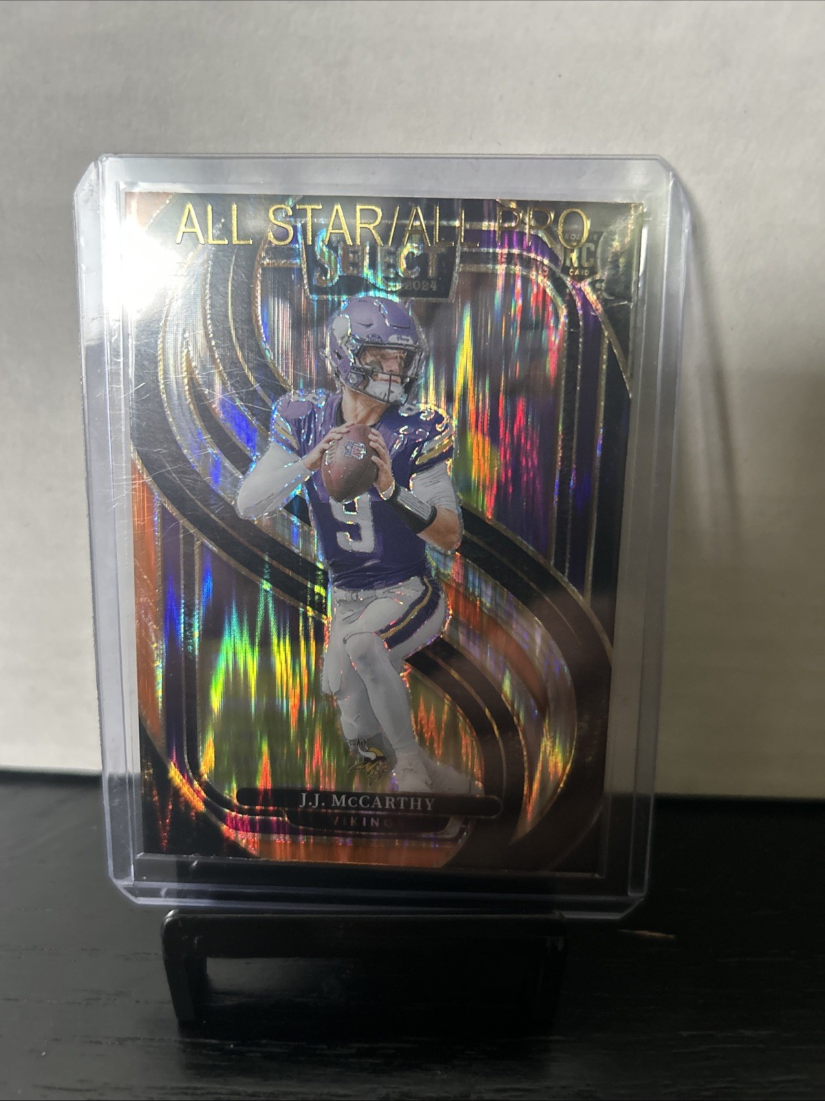 2024 Panini Select - Premier Level J.J. McCarthy #134 Black & Orange Shock Prizm